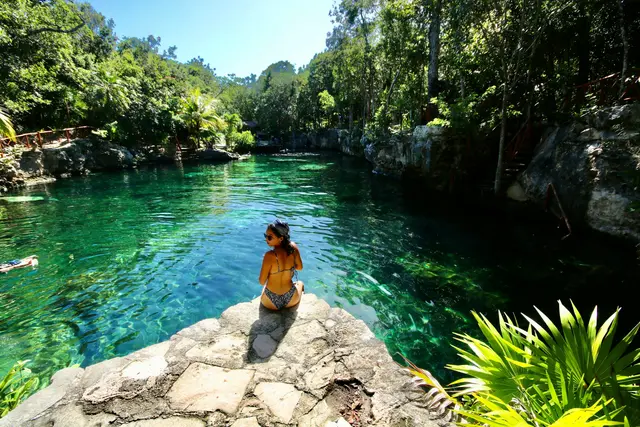 Open turquoise cenote in Tulum