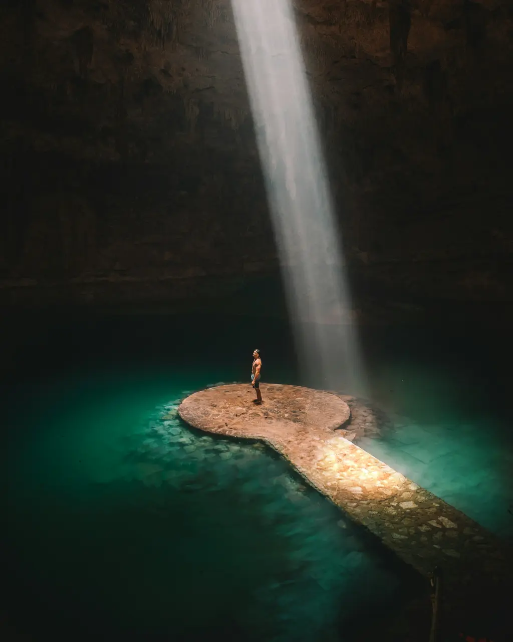 Light beam inside a cavern cenote in Tulum