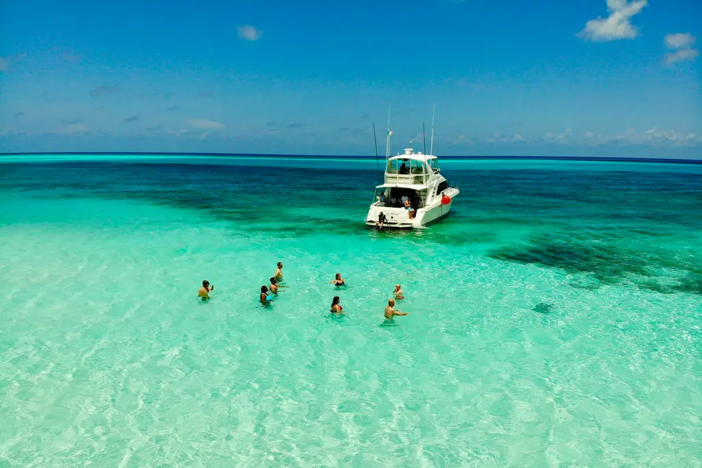 Yacht and swimmers at El Cielo, Cozumel