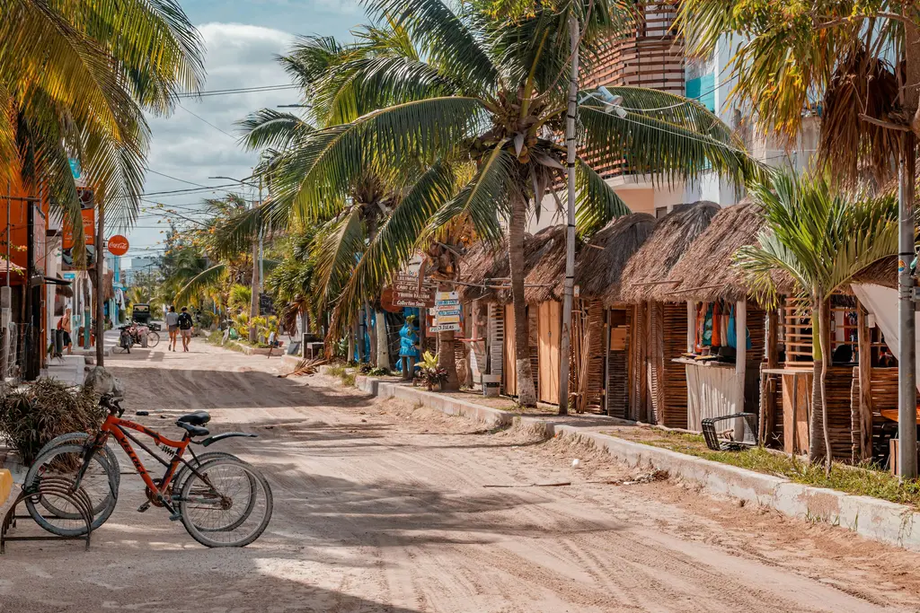 Sand street with palapas on Holbox