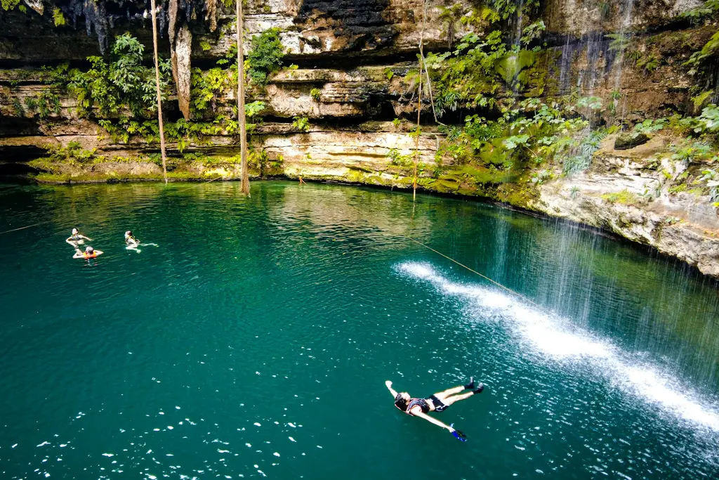 People swimming in a cenote near Chichén Itzá